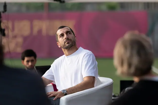 Henrikh Mkhitaryan seated during an on-stage interview